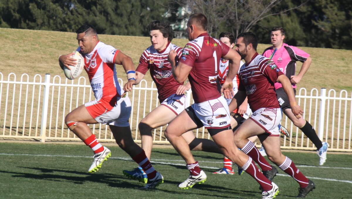 ROTA BLADES: Rotu Seta out runs Blayney Bears players to score a try in his side's big win. Setu also kicked nine from nine conversions. Photo: Robyn Murray 