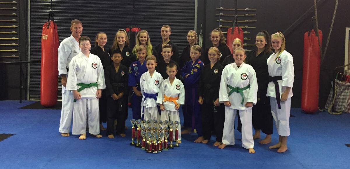 WHAT A PERFORMANCE: The team at Precision Martial Arts school starred at the International Sports Karate Association state championships. Photo: CONTRIBUTED