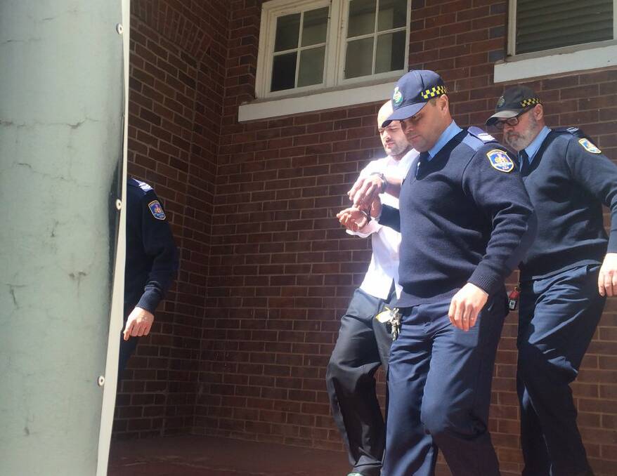 Vincent Stanford led to corrective services van after given a life sentence for the murder of Stephanie Scott. Pic: @em_partridge via Twitter