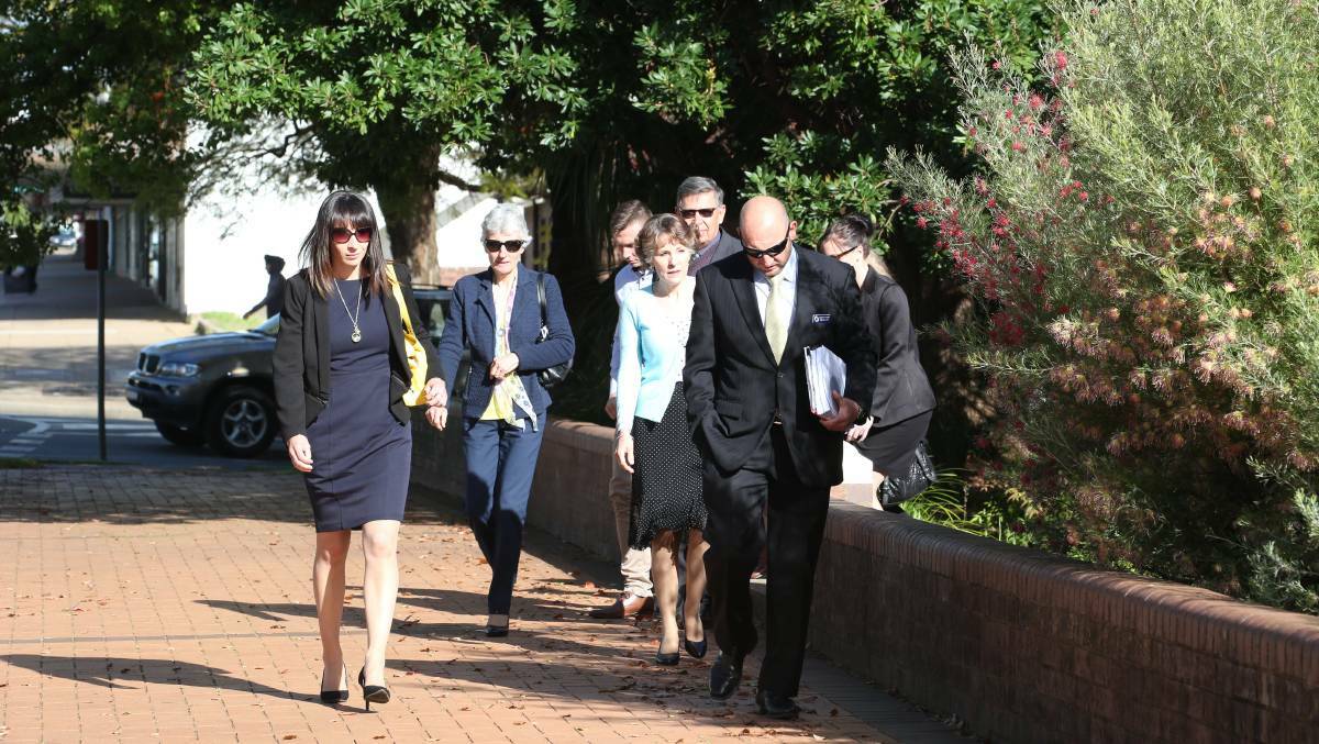 Detective Sergeant Tim Clark and members of the Scott family arrive at Griffith courthouse on Tuesday morning. Picture: Anthony Stipo
