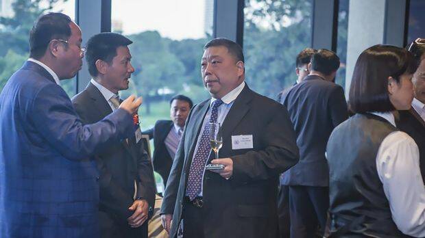 Huang Xiangmo (far left) and NSW state MP Ernest Wong at the 2014 unveiling of an Australian Guangdong Chamber of Commerce plaque at NSW Parliament. Photo: Australian Guangdong Chamber of Commerce
