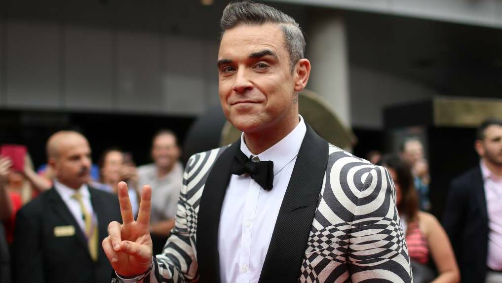 Robbie Williams arrives at the 2016 ARIAs. Check out more red caret photos by just hitting the image.