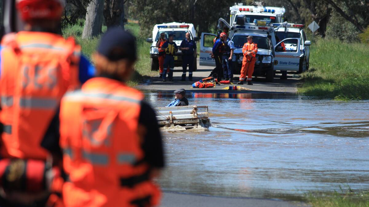 SES, police and ambulance spent more than six hours attempting to convince a trapped motorist to be rescued.
