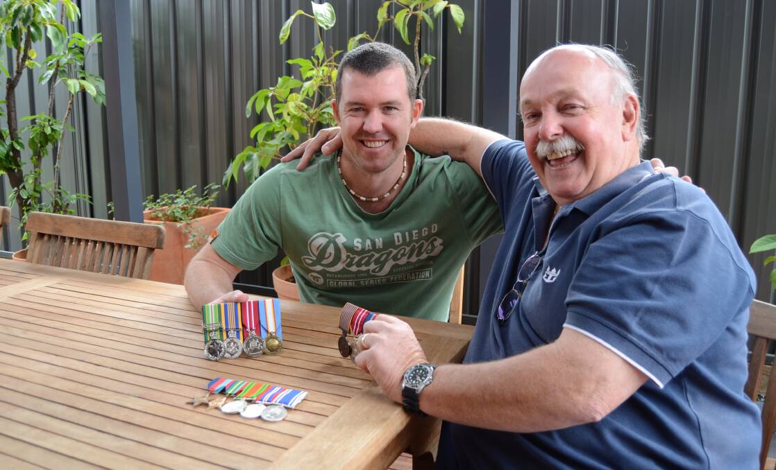 ANZAC DAY: Dubbo man Jeff Caldbeck and his son Brendan will march together on Anzac Day. They are pictured with each other own medals, as well as Jeff's father's who served in WWII. Photo: ELOUISE HAWKEY