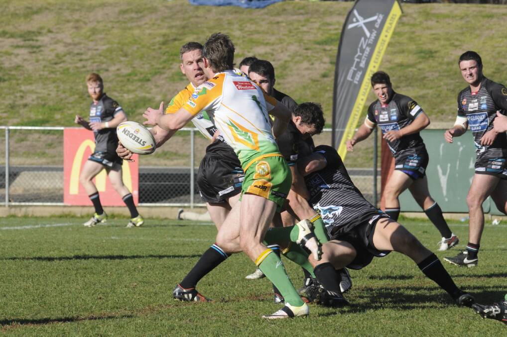 ONE OF THE BEST: Simon Osborne, pictured offloading to Ben McAlpine, was CYMS' best in their win over Panthers on Sunday. Photo: CHRIS SEABROOK 071716cpan3a