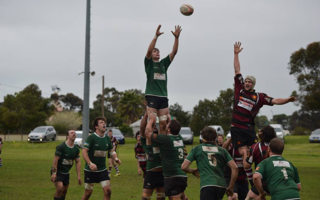 UP THERE CAZALY: Jayden Norris flies high to win a lineout during Emus' 37-0 win over Parkes. Photo: JACK HART