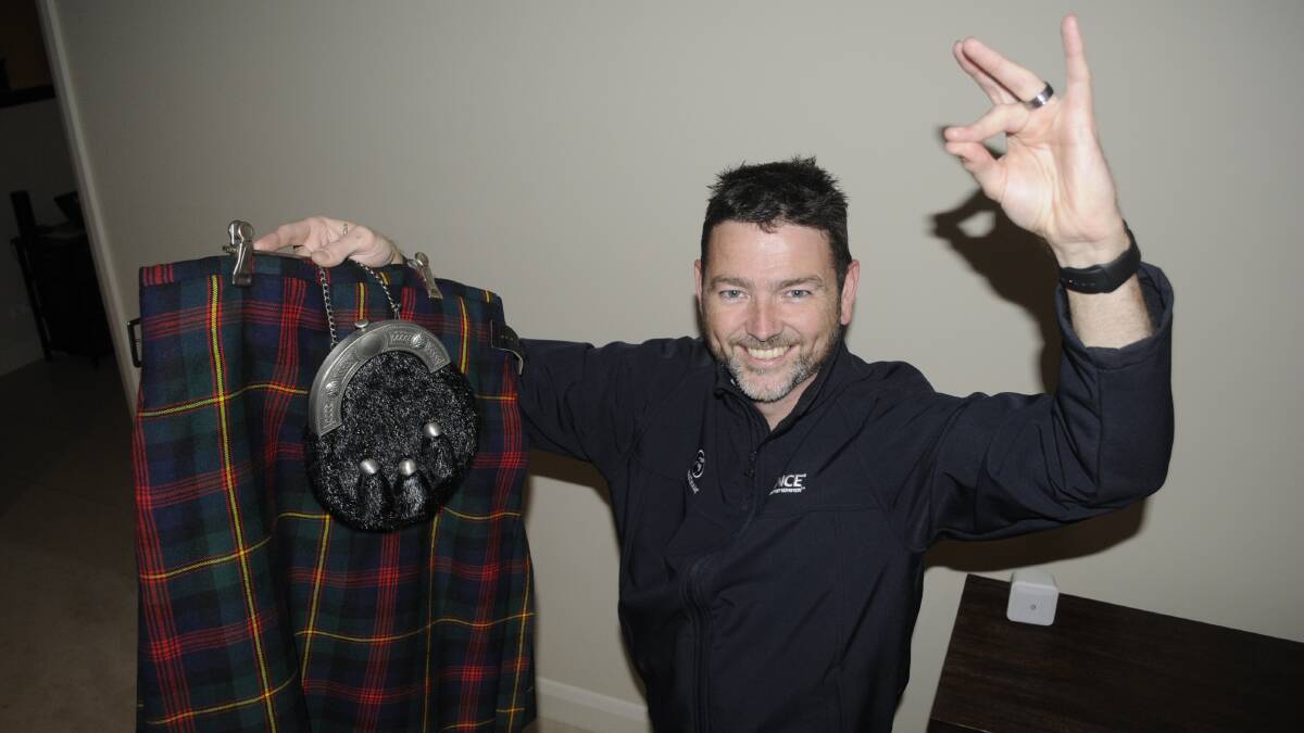 READY TO COMPETE: Star of Bathurst Bruce Tasker pictured getting his kilt ready for Saturday night's dance-off. Photo: CHRIS SEABROOK