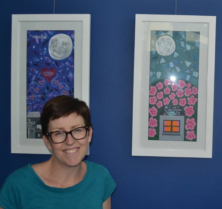 OFF THE WALL: Arts OutWest project officer Penny May with some of the paintings in the exhibition by Bathurst artist Alesha Elbourne.