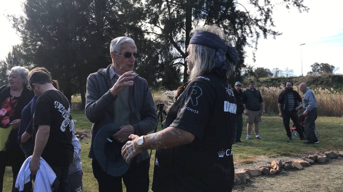 DOWN BY THE RIVER: Pat Alexander (descendant of the Rankin family) and Dinawan Dyirribang (descendant of Wiradyuri warrior Windradyne) speaking after the ceremony on Monday. Photo: TRACY SORENSEN