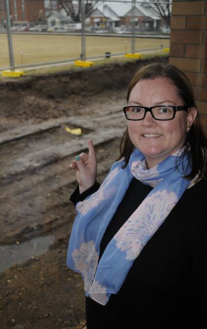 HERITAGE: Sarah Griffin from the Bathurst City Community Club (BCCC) with the historic foundations. Photo: CHRIS SEABROOK 080216cdig1