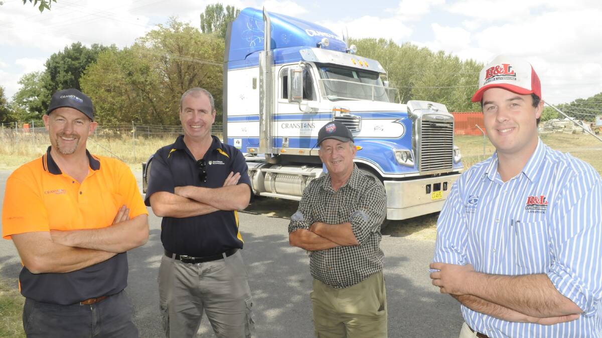FRIENDS IN DEED: Hay run organisers Brett Cranston, Steve Ellery, Councillor Bobby Bourke and James Walton at the drop-off point on Church Lane. Photo: CHRIS SEABROOK