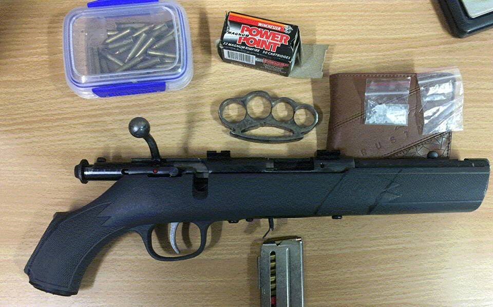HAUL: The gun, ammunition, drugs and knuckle-dusters allegedly seized by police after stopping a car at Walang on Thursday morning. Photo: NSW POLICE