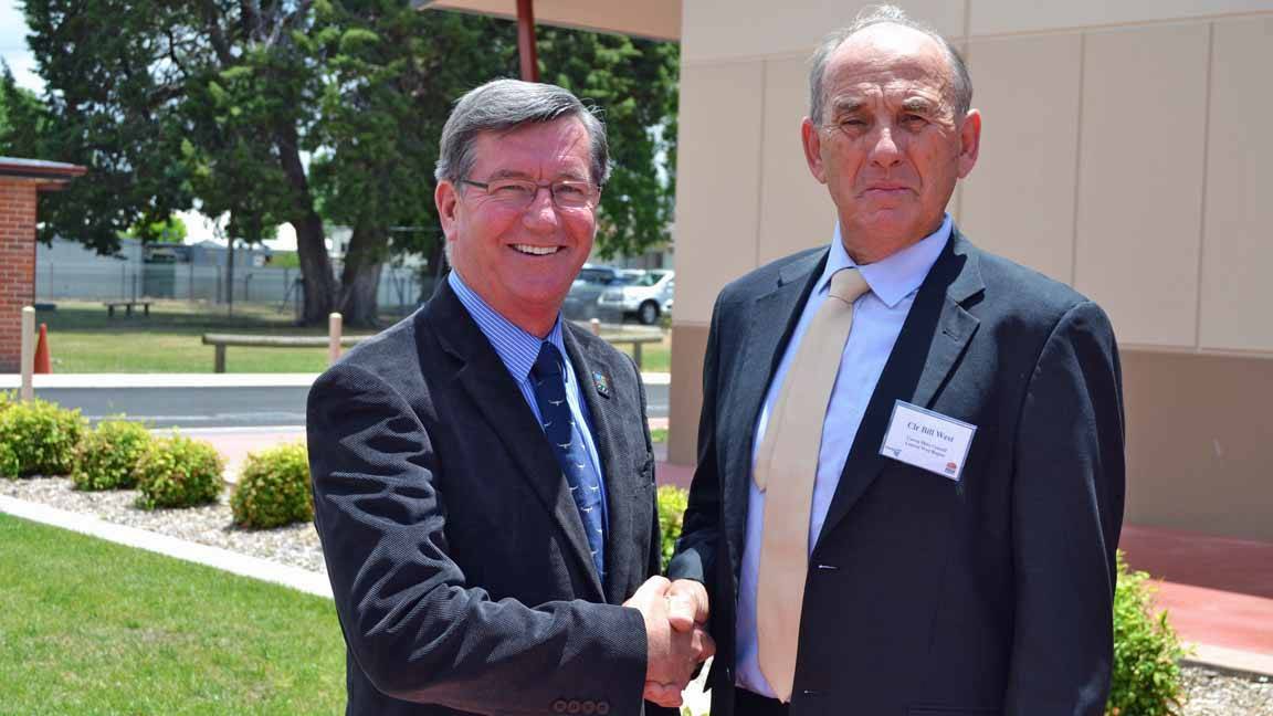 SHAKE IT UP: New Centroc chairman Gary Rush pictured last year with outgoing charmain, Cowra mayor Bill West.