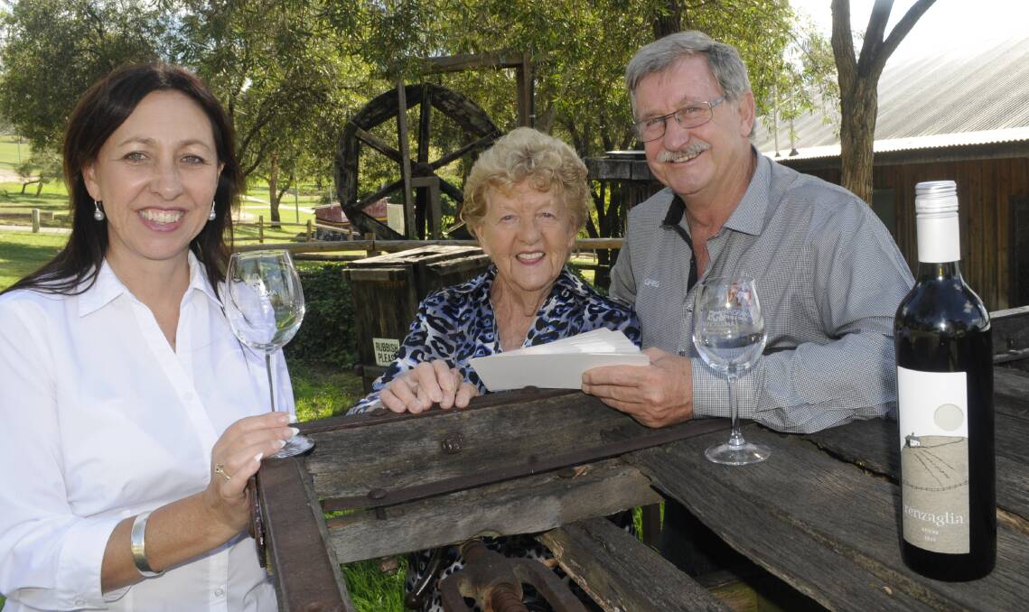 CHEERS: Bathurst Goldfields owners Debbie Campbell and Ruth Lennon with Panorama Cruise and Travel director Greg Tucker promoting the Winter Winery Wander. Photo: CHRIS SEABROOK 032817cwwwander