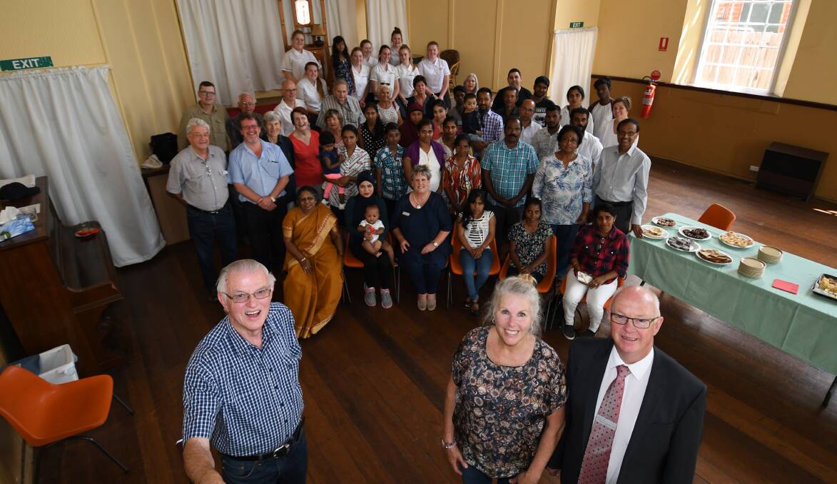 WELCOME: Bathurst Refugee Support Group chairman Brian  Mowbray, Welcome Team Leader Catherine Wood and mayor Graeme Hanger with the visitors to our city.