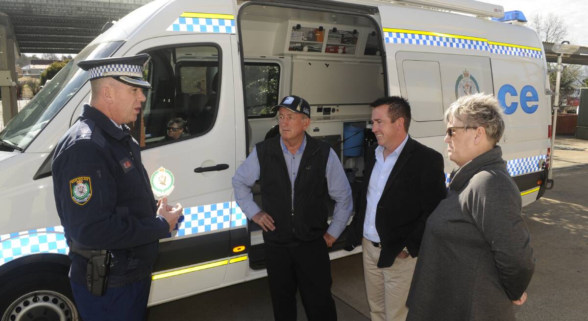 MOBILE STATION: Acting Superintendent Peter McKenna with council candidates Bobby Bourke and Jacqui Rudge and Bathurst MP Paul Toole on Monday. Photo: CHRIS SEABROOK