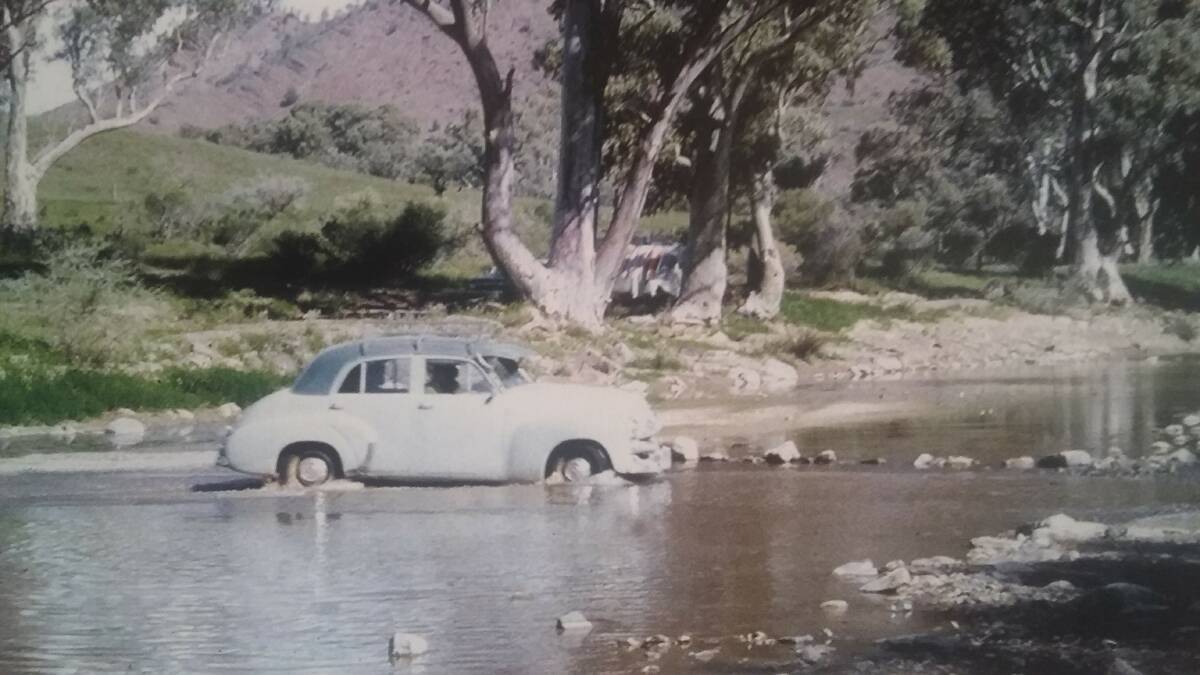ALL TERRAIN: To mark the occasion of the last Holden rolling off the line last week, this photo shows an FJ Holden crossing the Turon River in the late 1950s.
