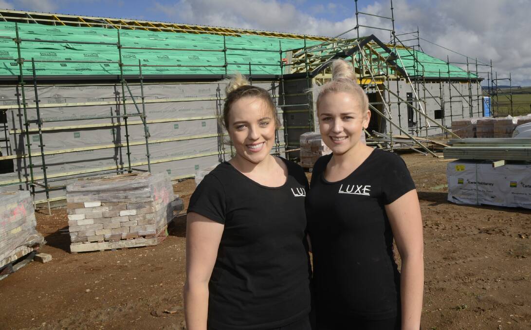 SISTER ACT: Melissa, left, and Kayla Atkins are two budding young entrepreneurs from Bathurst who have big thinks planned for their BoxGrove function centre near Eglinton. Photo: PHILL MURRAY 060916pwedding