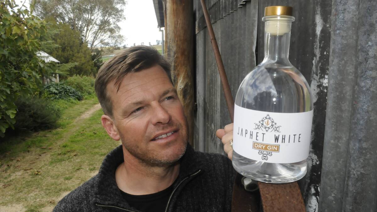 LITTLE BOTTLER: Ian Glen from Bathurst's Stone Pine with a bottle of his new Japhet White Dry Gin. Photo: CHRIS SEABROOK