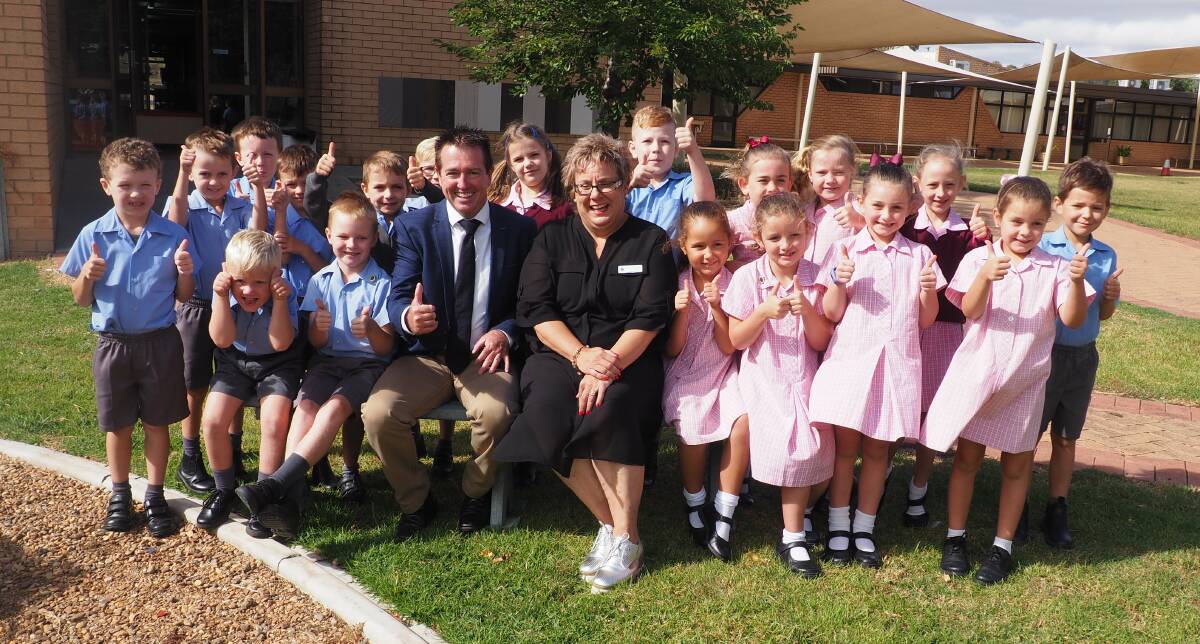 GREAT OUTDOORS: Bathurst MP Paul Toole with St Philomena’s School principal Louise Davies and some happy Year 1 students. Photo: SUPPLIED