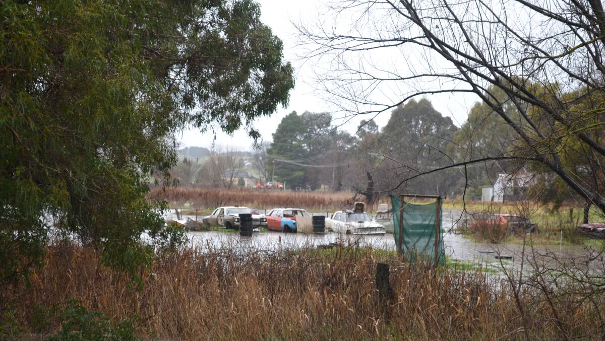 NATURAL DISASTER: Flooding in Perthville on July 20 after the Queen Charlotte Creek broke its banks. Photo: NADINE MORTON