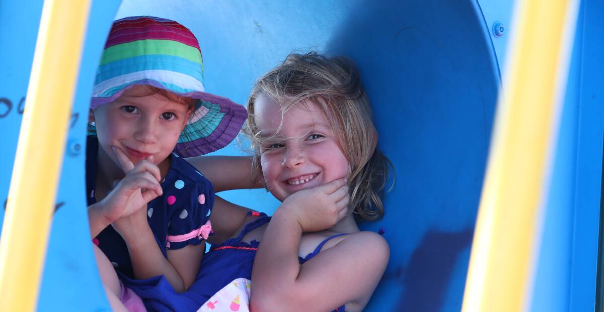 SNAPSHOT: Clara and Lilian Klootwijk playing in Centennial Park on Sunday afternoon. Photo: PHIL BLATCH
