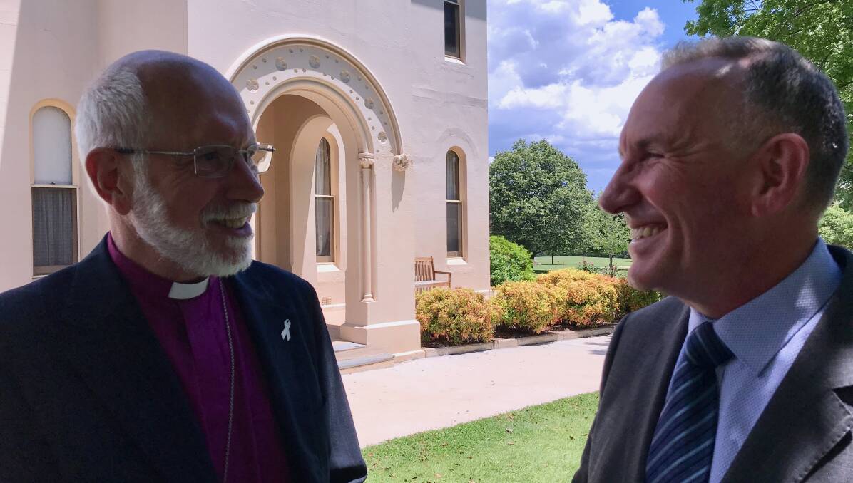 NEXT STEP: Anglican Bishop of Bathurst Ian Palmer and Presbyterian Church in NSW general manager Jeof Falls celebrating the exchange of contracts today. Photo: SUPPLIED