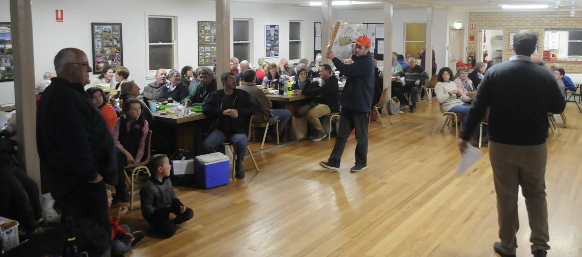SNAPSHOT: Auctioneer James Walton helping out at a fundraising trivia night at Yetholme Community Hall on Saturday night. 081217ctractr12