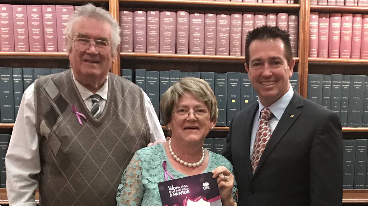 WOMAN OF THE YEAR: Laurie McMahon (centre) with her husband Ray and Bathurst MP Paul Toole.