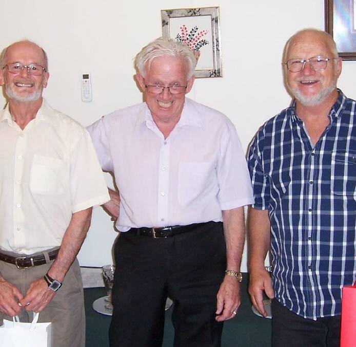 TEAMWORK: President Chris Rosevear (centre) with Phil Cummings and Dick Ellis who finished second in the pairs. 