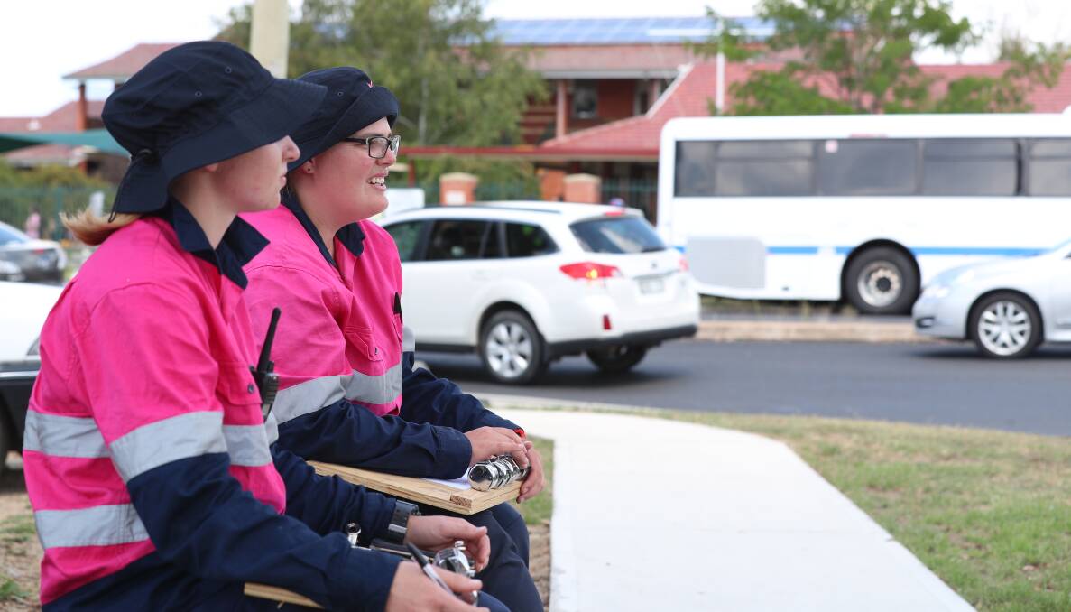 COUNTING CARS: Jasmine Howlett and Cassandra Martin conducting a manual traffic count at the intersection of Mitre, Suttor and Lambert streets near the Assumption School. Photo: PHIL BLATCH