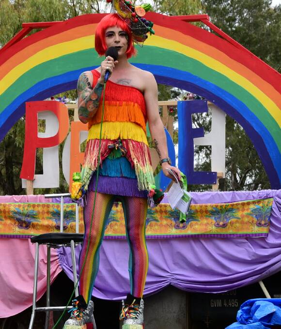 TAKING A STAND: Nicholas Steepe addresses the crowd that took part in the Central West Pride March in Dubbo on Saturday. The march had a carnivale theme. Photo: PAIGE WILLIAMS