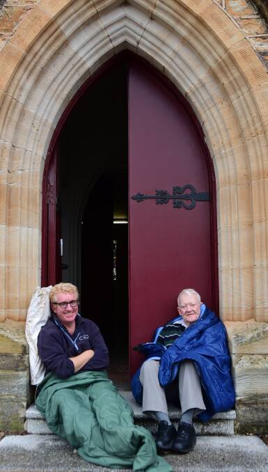 SLEEPING ON IT: Andrew McKay and Dan Sullivan get a feel for Thursday's Dubbo Winter Sleepout in St Brigid's Church Hall . Photo: BELINDA SOOLE