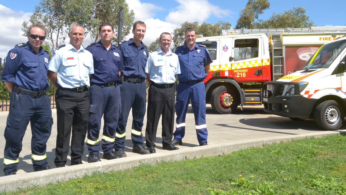 UNITED FRONT: Station officer Sandy Collins, Inspector Bob Mey, firefighter Mark Robertson, senior firefighter Brad McWilliams, firefighter Tim Goodlet and NSW Ambulance Inspector Rhys Dive.