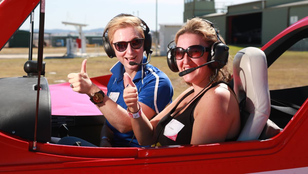 MAIDEN FLIGHT: Flight instructor Claire Ferguson takes Erin Mellor for a spin at the Women with Wings event at Bathurst airport.
