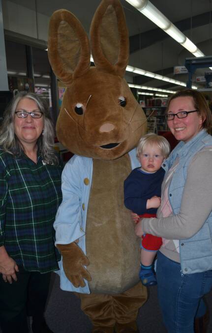 BOOK WEEK FUN:Jenny Barry, with Peter Rabbit and Emma Colvin holding Otto Meumann-Colvin, aged one, at the Bathurst Library.