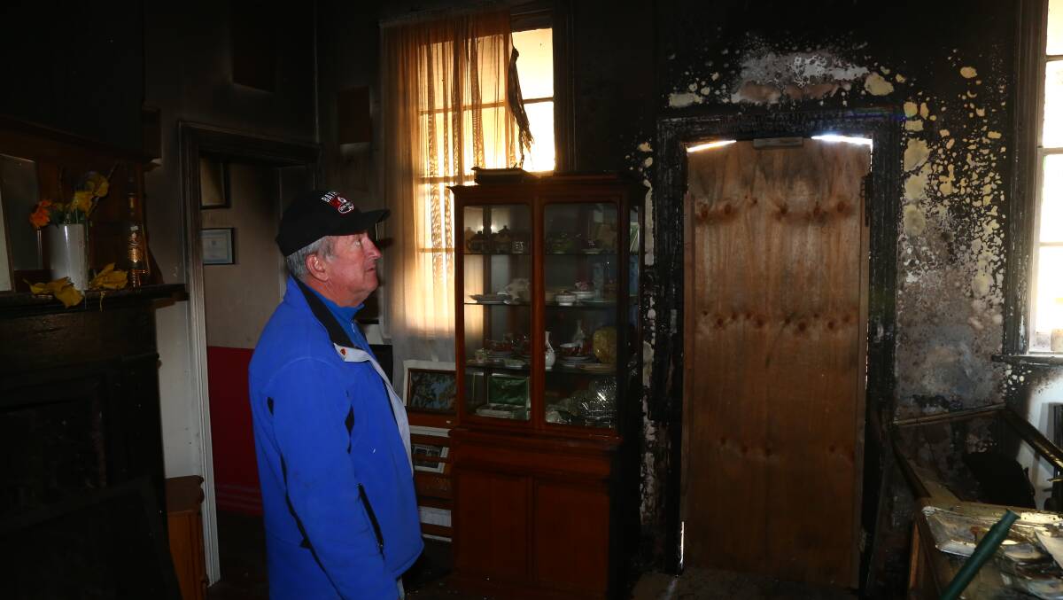 DEVASTATING: Councillor Bobby Bourke has a look at the damage at the Bathurst Community Op Shop.