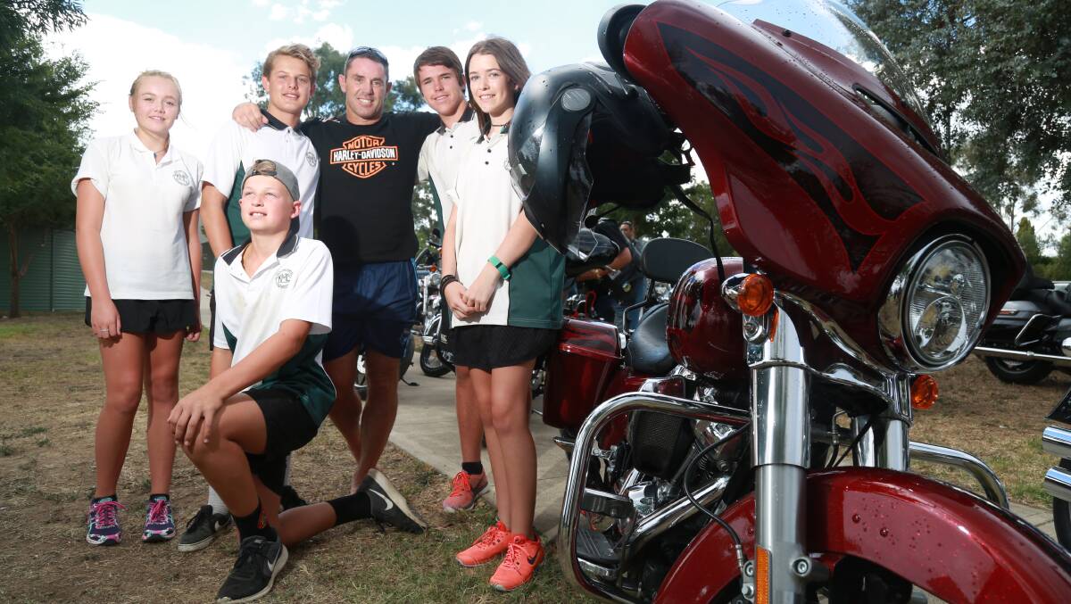 HOGS FOR HOMELESS: NRL legend Brad Fittler surrounded by Kelso High School students during a visit to the school on Friday.