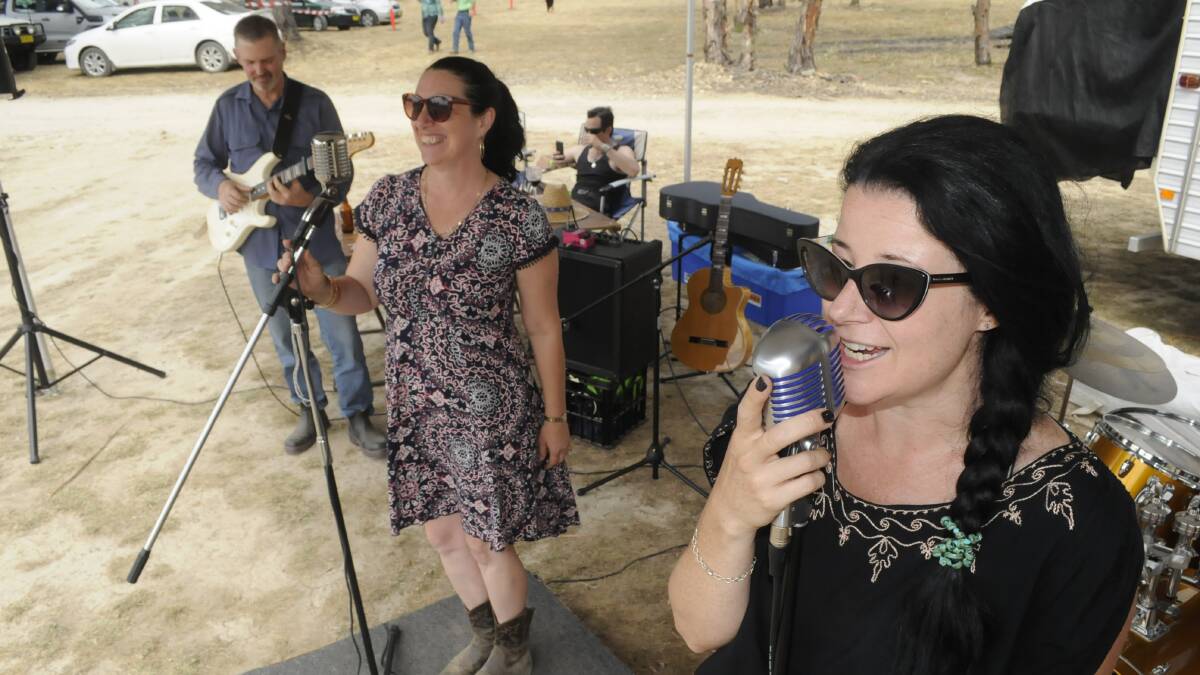 ON STAGE: Left, members of The Bootleggers band, Tanya Gray and Emma Simpson, entertained the crowd at the Wattle Flat Bronze Thong. Photo:CHRIS SEABROOK 021817cthong3