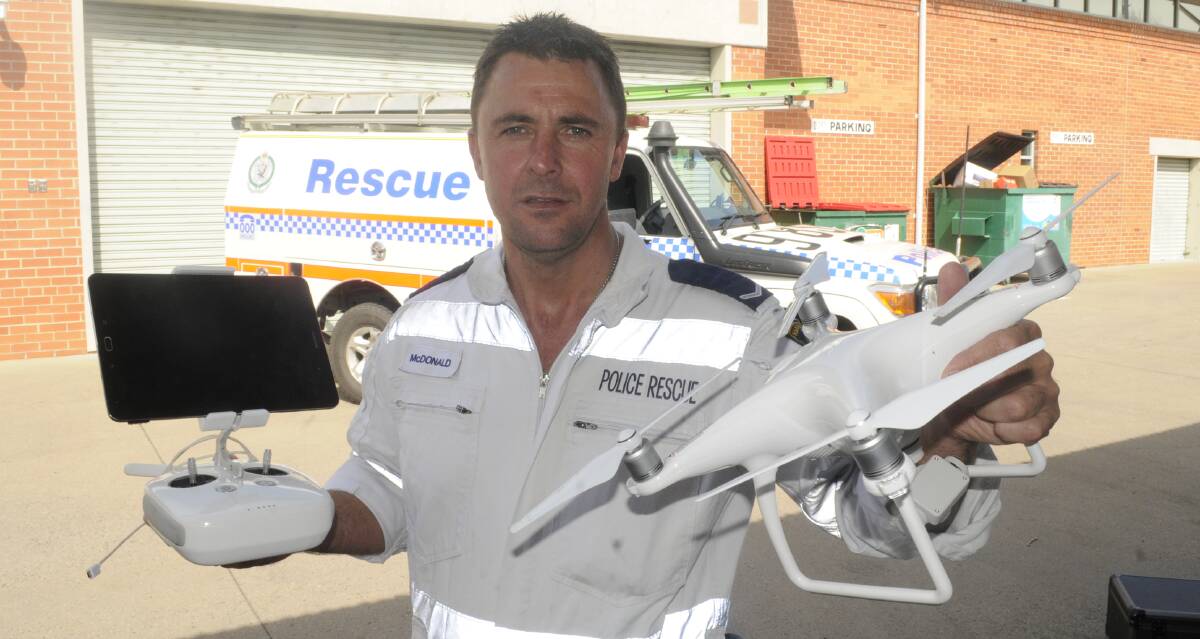 NEW TECHNOLOGY: Constable Glenn McDonald from Chifley Local Area Command with the drone and its controls at Bathurst police station. Photo: CHRIS SEABROOK 083016cops2a