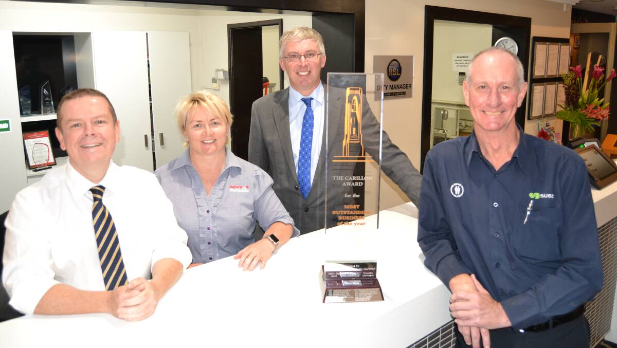 NEW HOME: The now retired business awards trophy with  RSL General Manager, Peter Sargent, Stacey Whittaker, chamber president Angus Edwards and Stephen Harper.