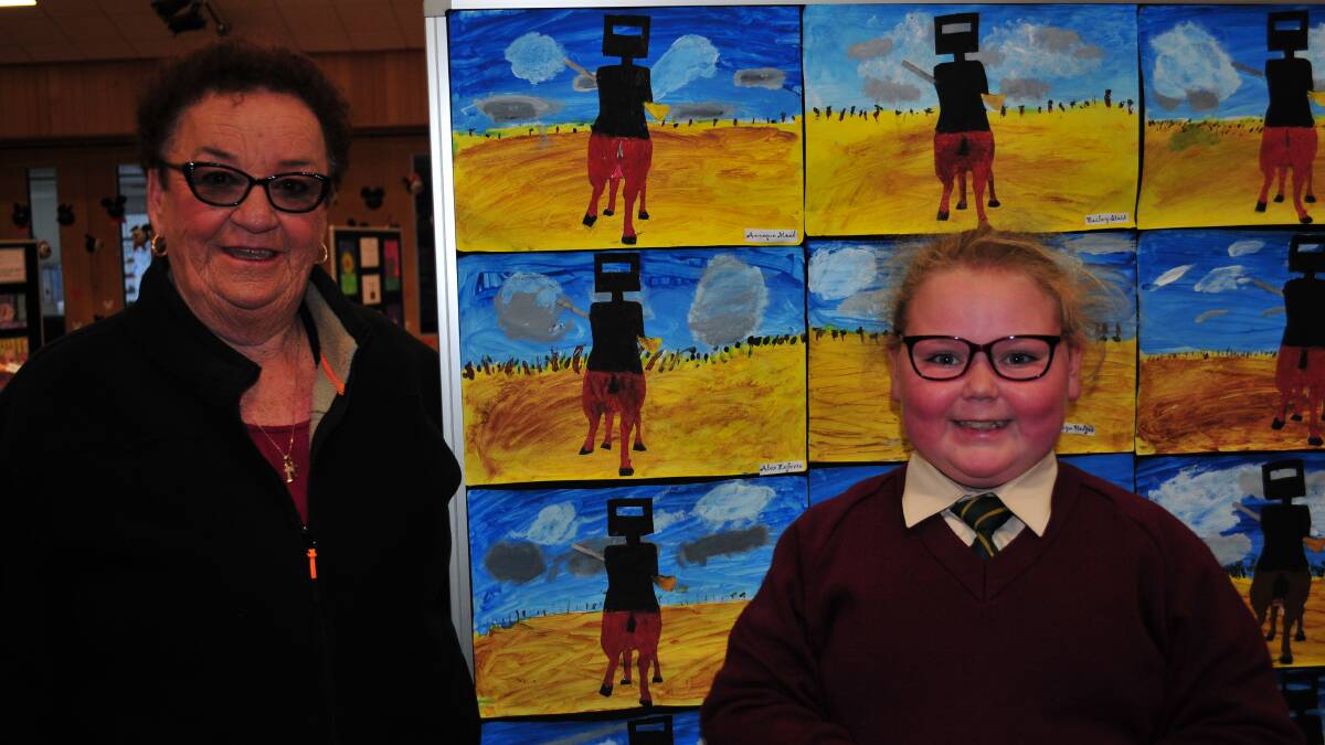 FAMILY DAY: Kevis Flanagan and Anneque Moad, looking at the Ned Kelly art work.