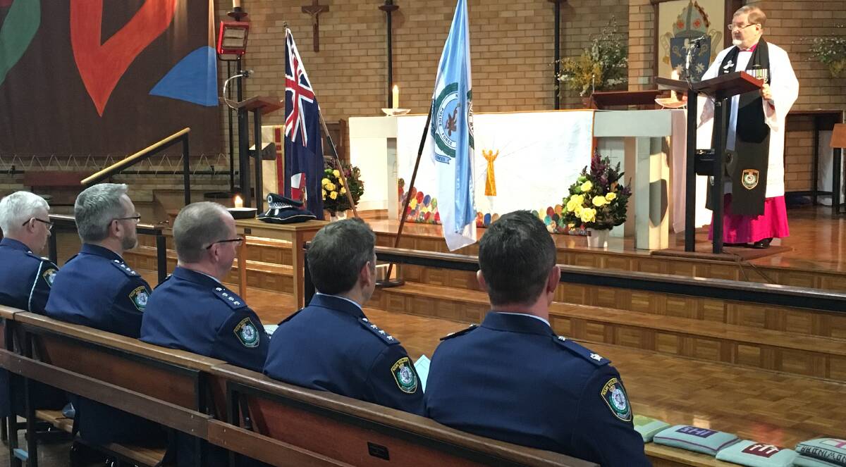 WE REMEMBER: Police chaplain, Bishop Richard Hurford, on National Police Remembrance Day at All Saints' Cathedral, Bathurst. Photo: NADINE MORTON 092916nmpolice5