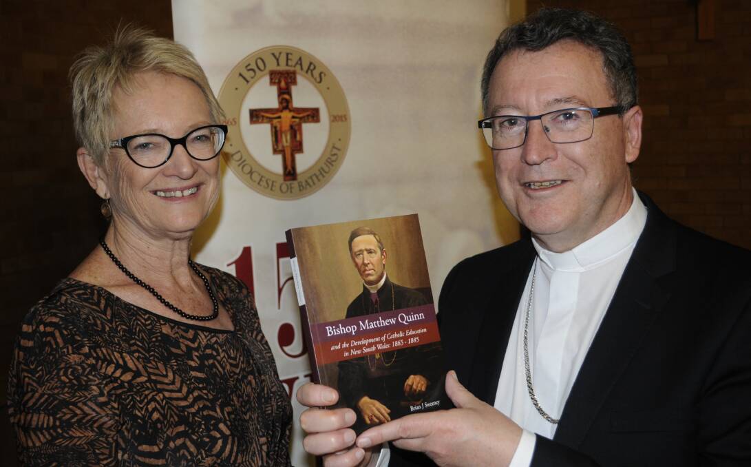 BOOK LAUNCH: Dr. Anne Wenham with Bishop Michael McKenna at the book launch of former Catholic Bishop Matthew Quinn. Photo:CHRIS SEABROOK 102616cbquinn