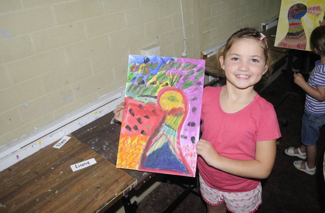 ARTIST IN THE MAKING: Liana Schmidt with her painting she did last week at the workshop. 011017cart7