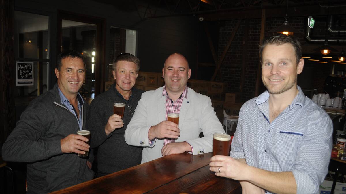 CHEERS: Brad Molenkamp and Shane Gilchrist with Two Heads Brewing co -owner, Greg Hedley.