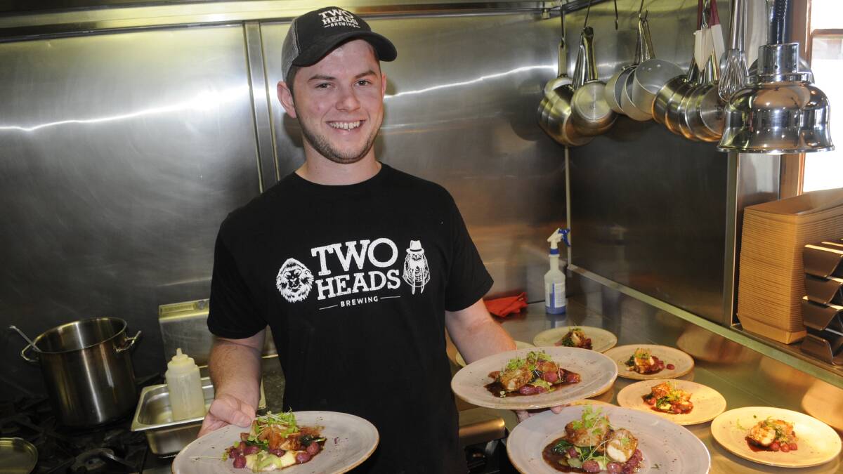 GREAT DAY: Tanner Jones (staff) serving up chicken breasts and parsnip puree. Photo:CHRIS SEABROOK 061817c2heads2