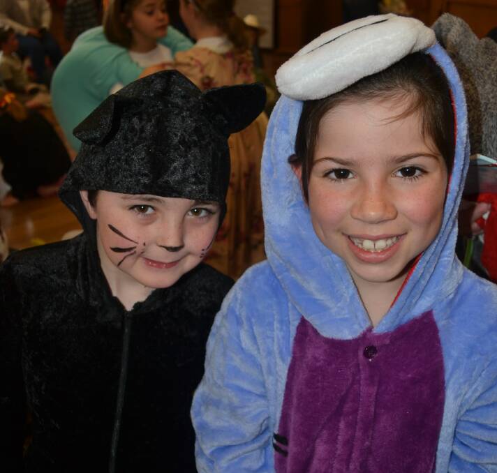 ALL SMILES: Joseph Thompson-Bower and Madelene Groves looked the part for the Book Week parade.