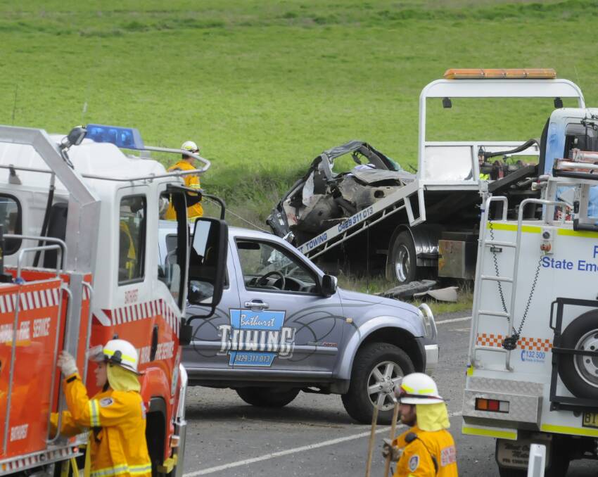 CRASH SCENE: Emergency crews working at the scene of Monday's crash, 12 kilometres south of Bathurst on the Mid Western Highway.