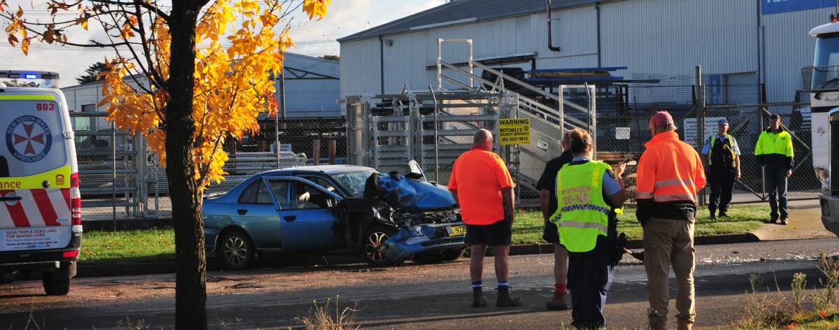 CRASH SCENE: The scene early Wednesday morning after a sedan and B-double collided in Toronto Street, in the Kelso Industrial Estate. Two people were transported to Bathurst Base Hospital following the crash.